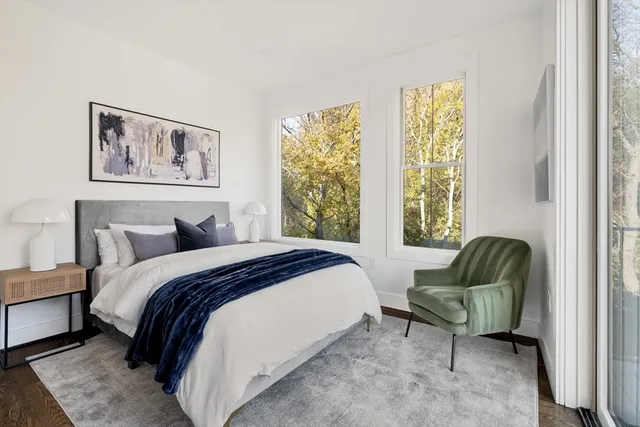 a bedroom with a bed and a couch