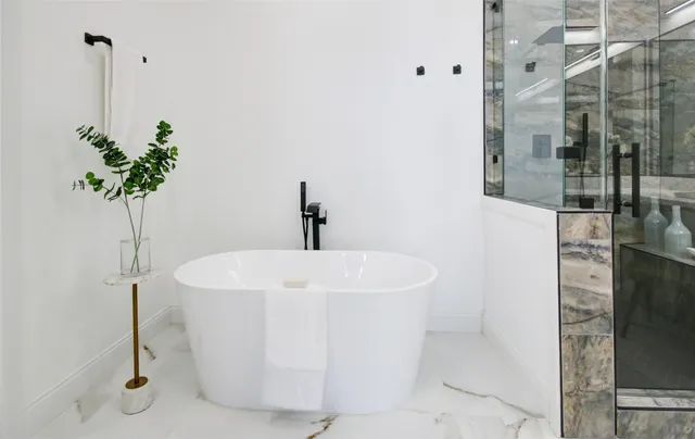 a white bath tub sitting in a bathroom