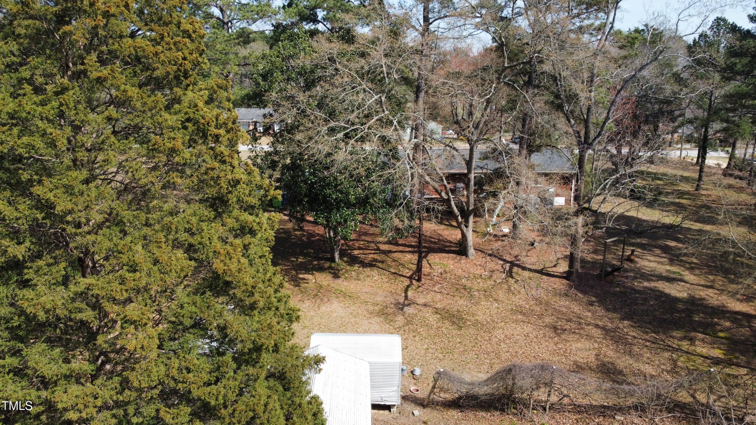 640 Sunnybrook Road Raleigh, NC 27610 - Photo 4 of 12 a backyard of a house with table and chairs