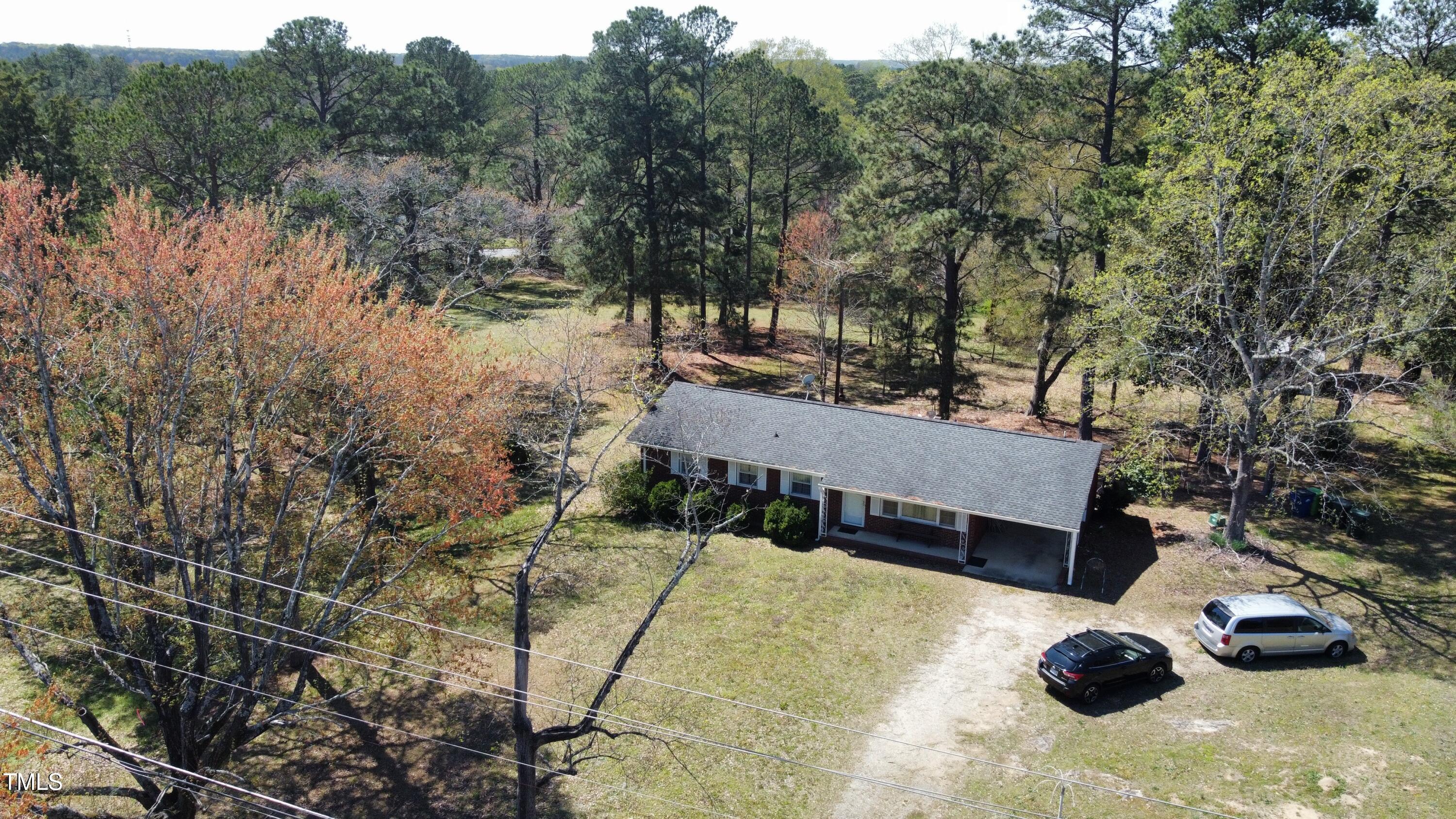 640 Sunnybrook Road Raleigh, NC 27610 - Photo 6 of 12 a view of backyard with swimming pool and trees in the background