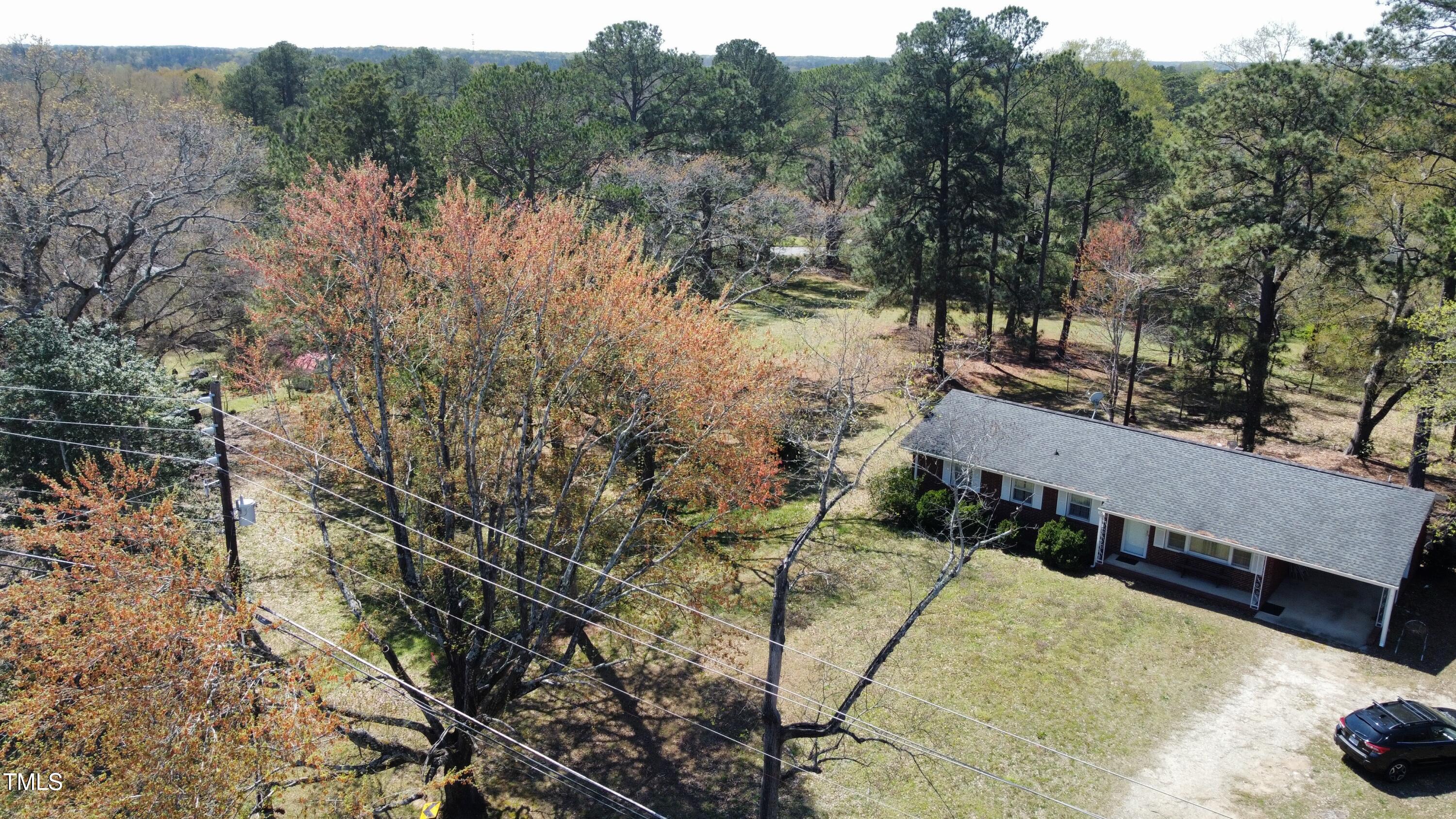 640 Sunnybrook Road Raleigh, NC 27610 - Photo 8 of 12 a view of a yard with trees
