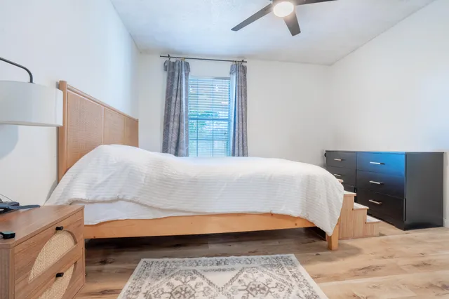 a bedroom with a bed and a dresser