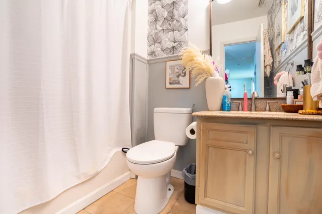 a bathroom with a toilet and a sink