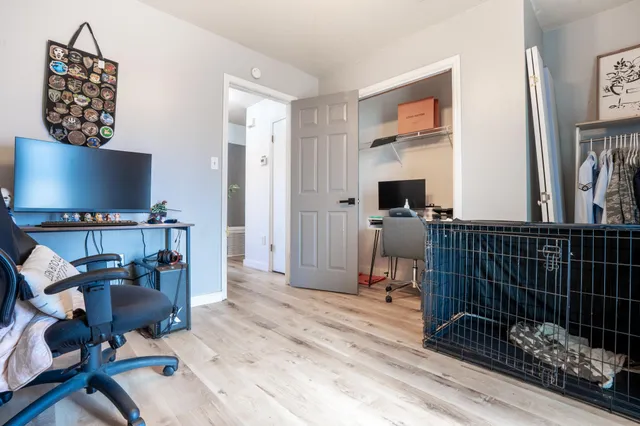 a workspace with furniture and a flat screen tv