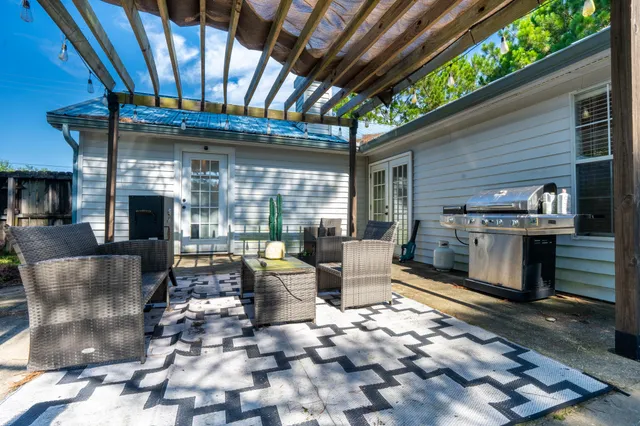 a outdoor living space with patio furniture and a fireplace
