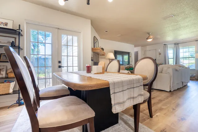 a view of a livingroom with furniture and a window