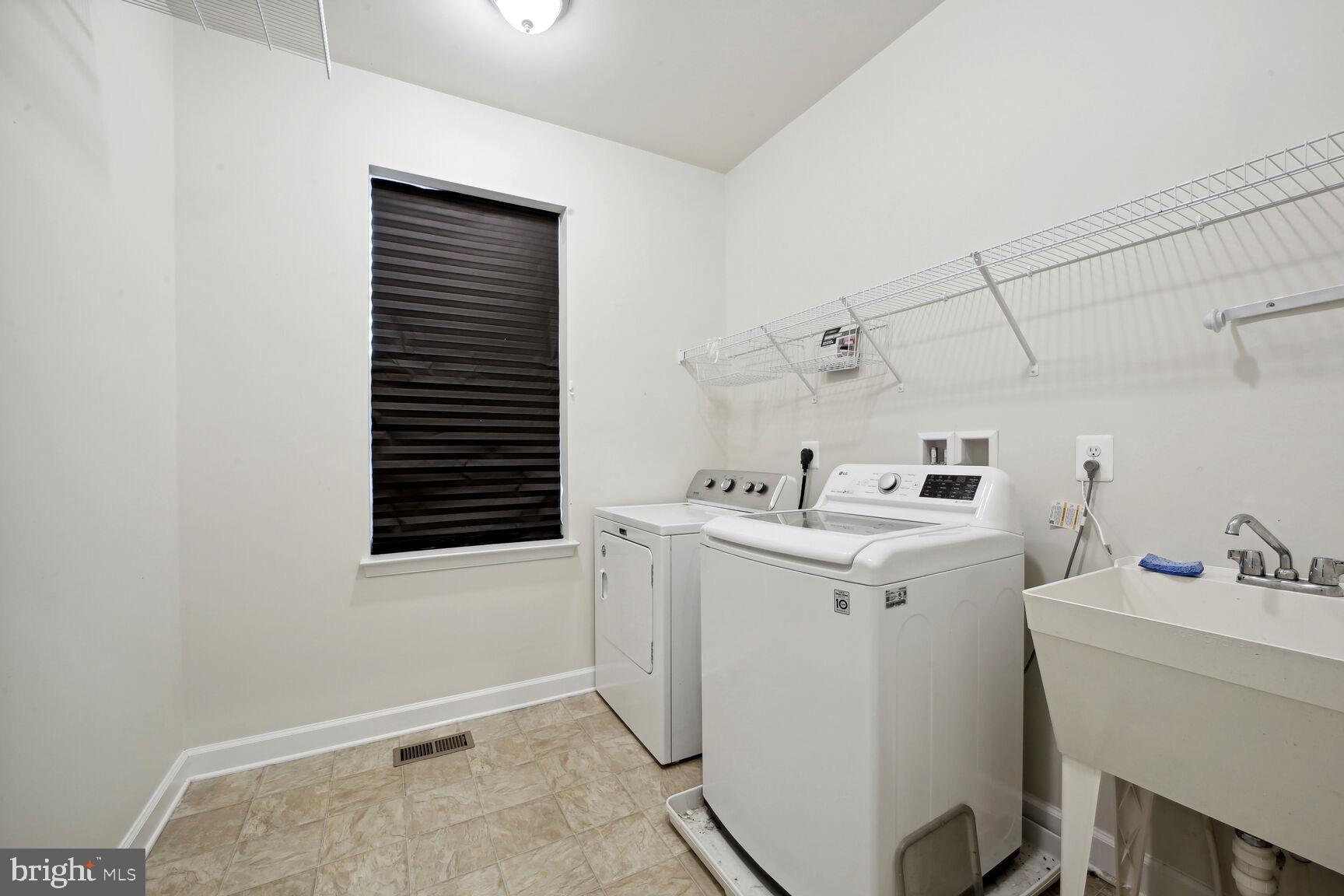 6201 Hunt Weber Drive Clinton, MD 20735 - Photo 28 of 30 a utility room with dryer and washer