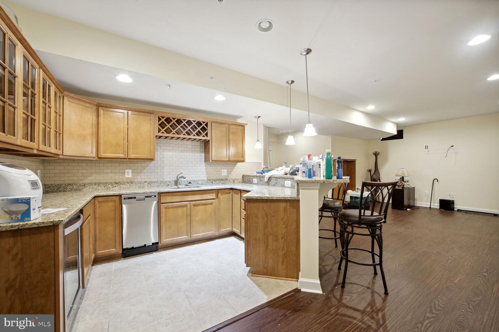 6201 Hunt Weber Drive Clinton, MD 20735 - Photo 7 of 30 a kitchen with cabinets and chairs