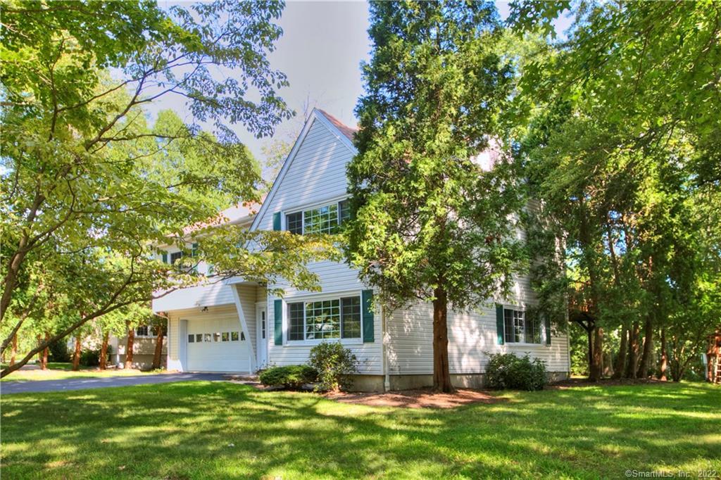 100 Mayfair Road Fairfield, CT 06824 - Photo 1 of 1 a front view of a house with a yard