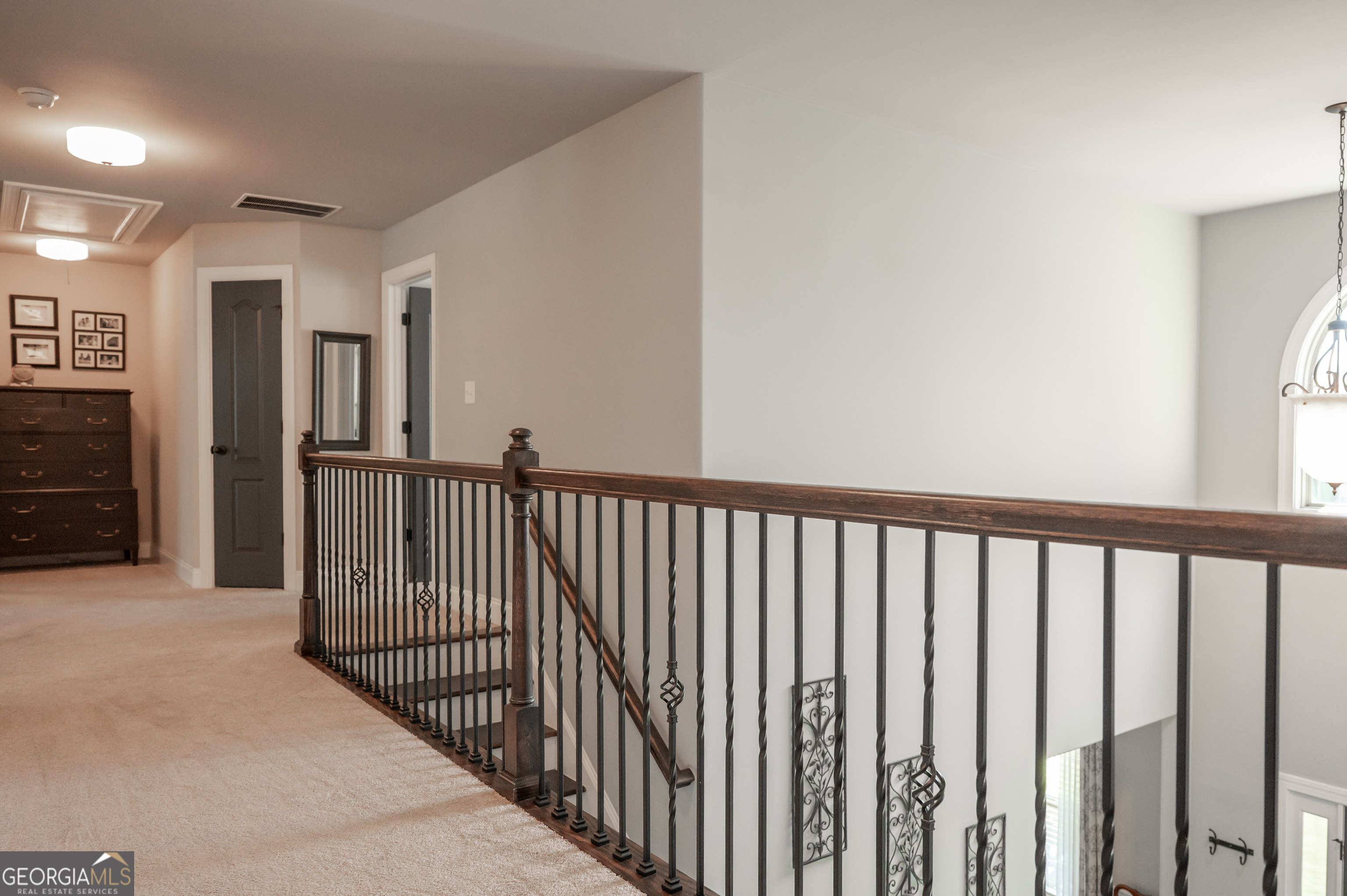 415 EAS Way Fayetteville, GA 30215 - Photo 42 of 70 a view of a hallway with wooden floor and windows