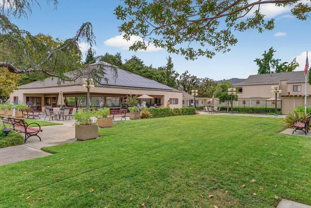 a view of a house with a small yard