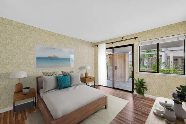 a spacious bedroom with a bed and wooden floor