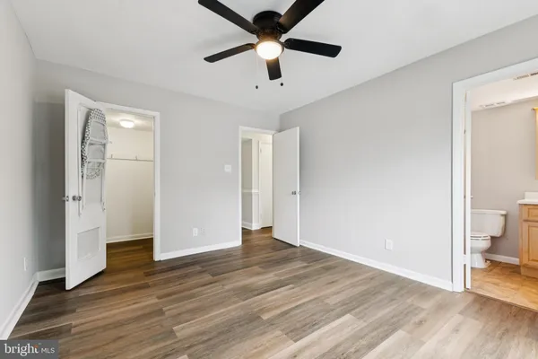 a view of an empty room and wooden floor