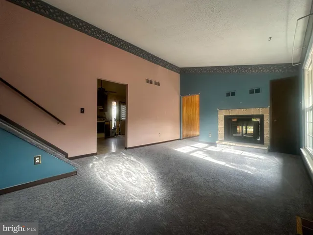 a view of a livingroom with a fireplace