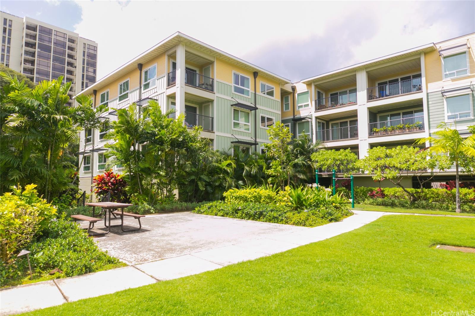 445 Kailua Road, Unit 5205 Kailua, HI 96734 - Photo 1 of 1 a view of a building with a yard and sitting area