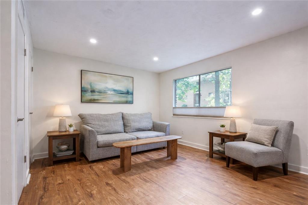 a living room with furniture and a window