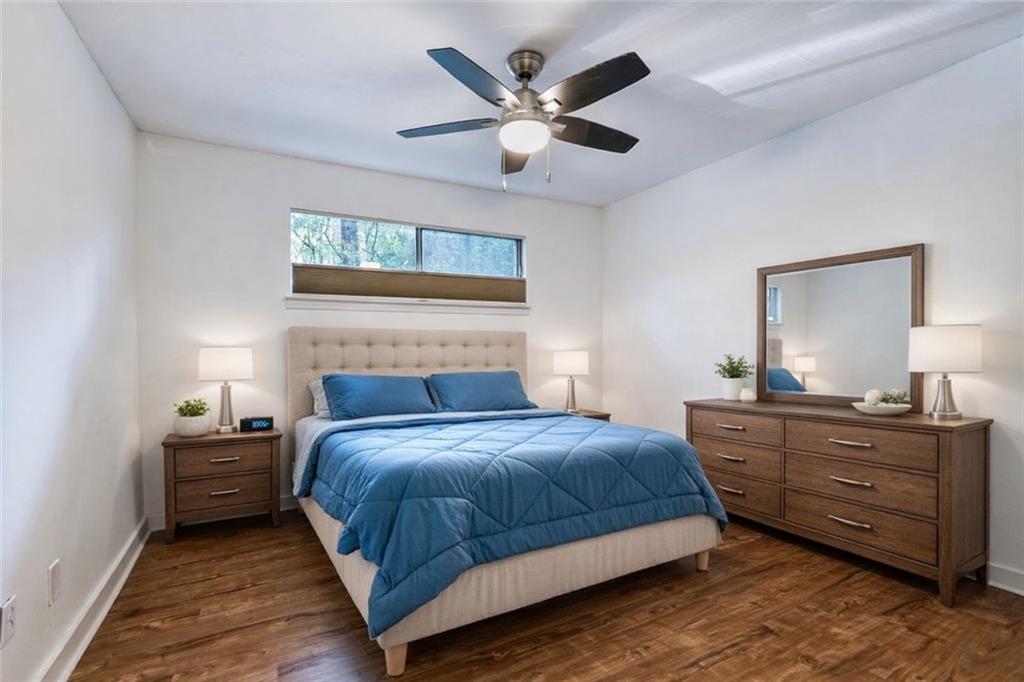 1133 Clairemont Avenue, Unit D Decatur, GA 30030 - Photo 11 of 20 a bedroom with a bed and a dresser