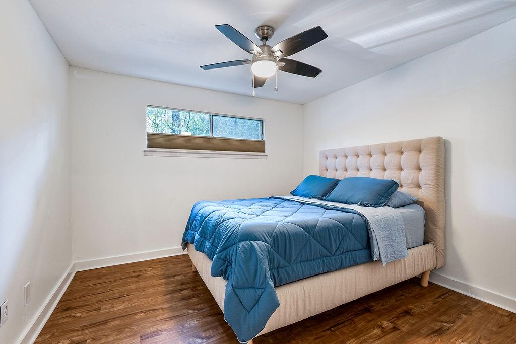 1133 Clairemont Avenue, Unit D Decatur, GA 30030 - Photo 12 of 20 a bedroom with a bed and window