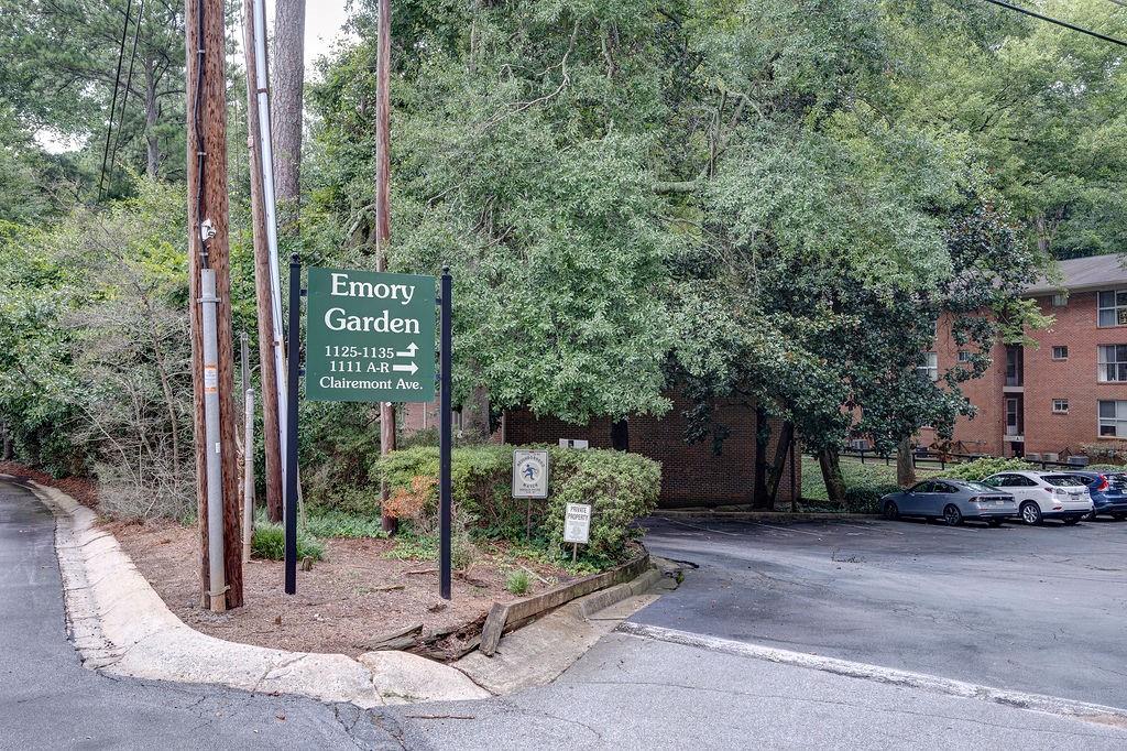 1133 Clairemont Avenue, Unit D Decatur, GA 30030 - Photo 20 of 20 a view of a park that has a sign board large trees