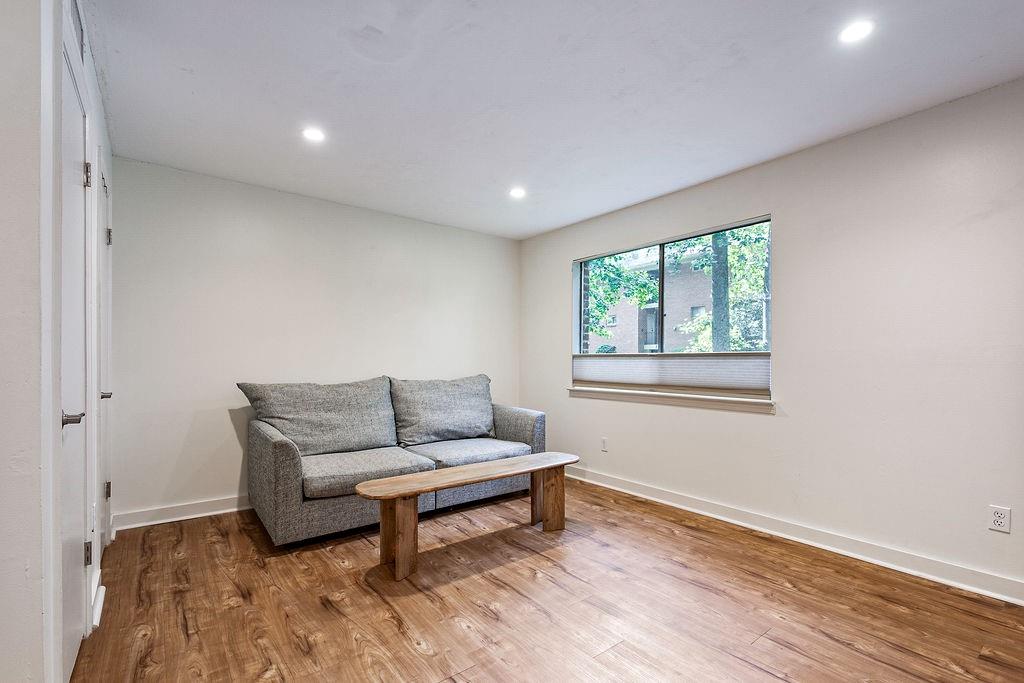 1133 Clairemont Avenue, Unit D Decatur, GA 30030 - Photo 2 of 20 a living room with furniture and a window