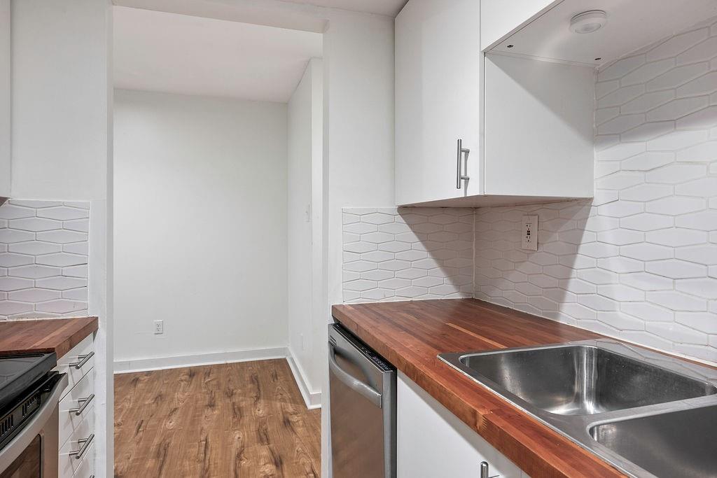 1133 Clairemont Avenue, Unit D Decatur, GA 30030 - Photo 10 of 20 a view of a kitchen that has a sink and a stove