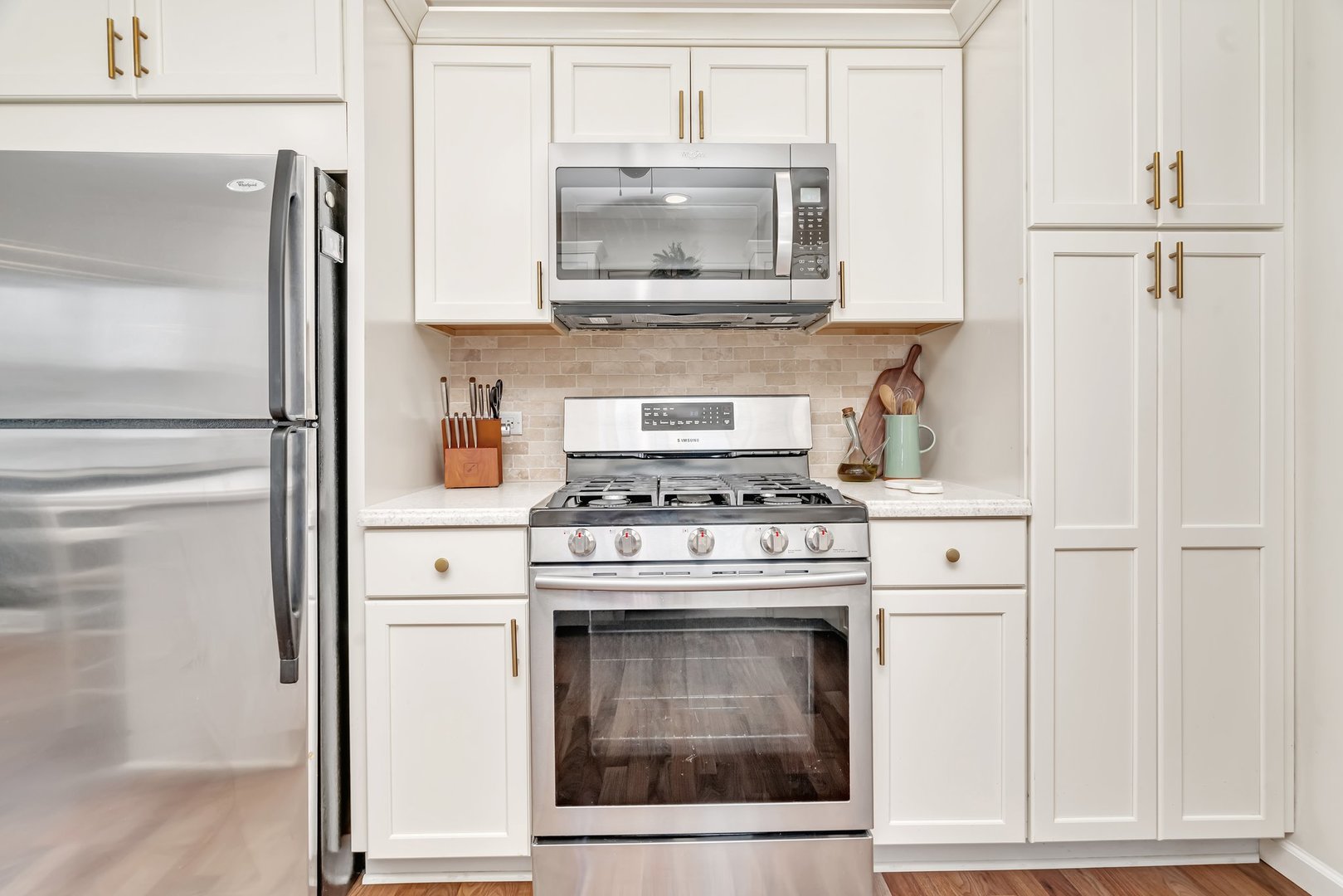 218 San Carlos Road Minooka, IL 60447 - Photo 15 of 40 a kitchen with granite countertop white cabinets and white appliances