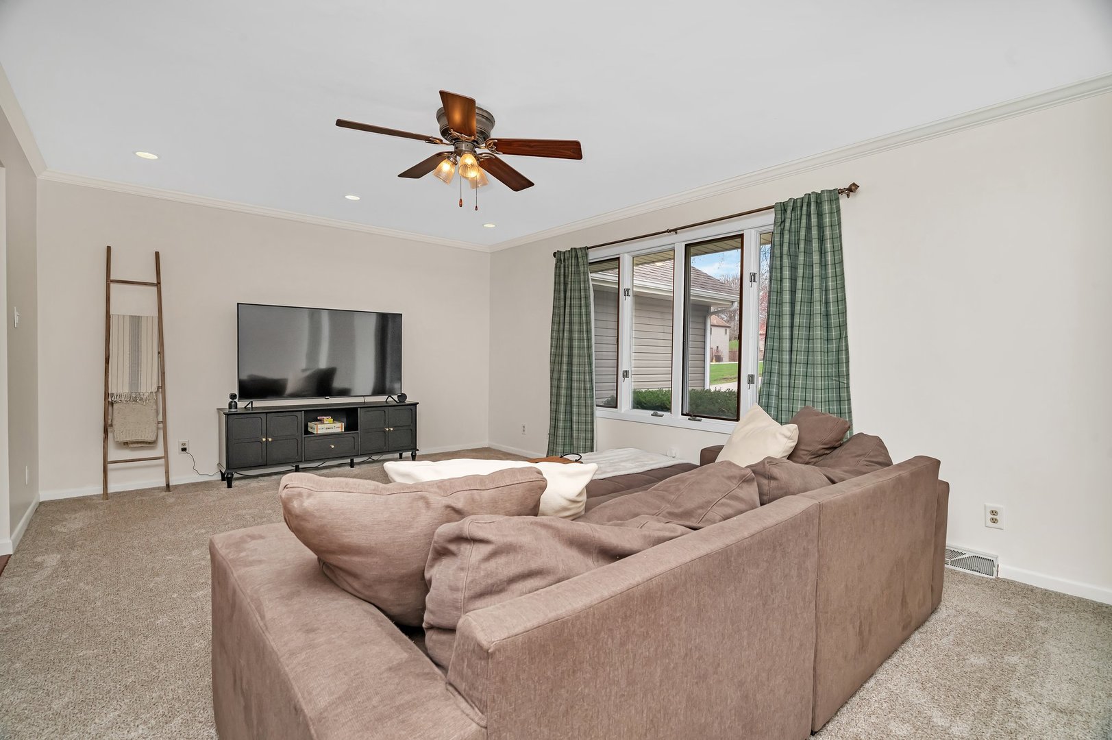 218 San Carlos Road Minooka, IL 60447 - Photo 20 of 40 a living room with furniture and a flat screen tv
