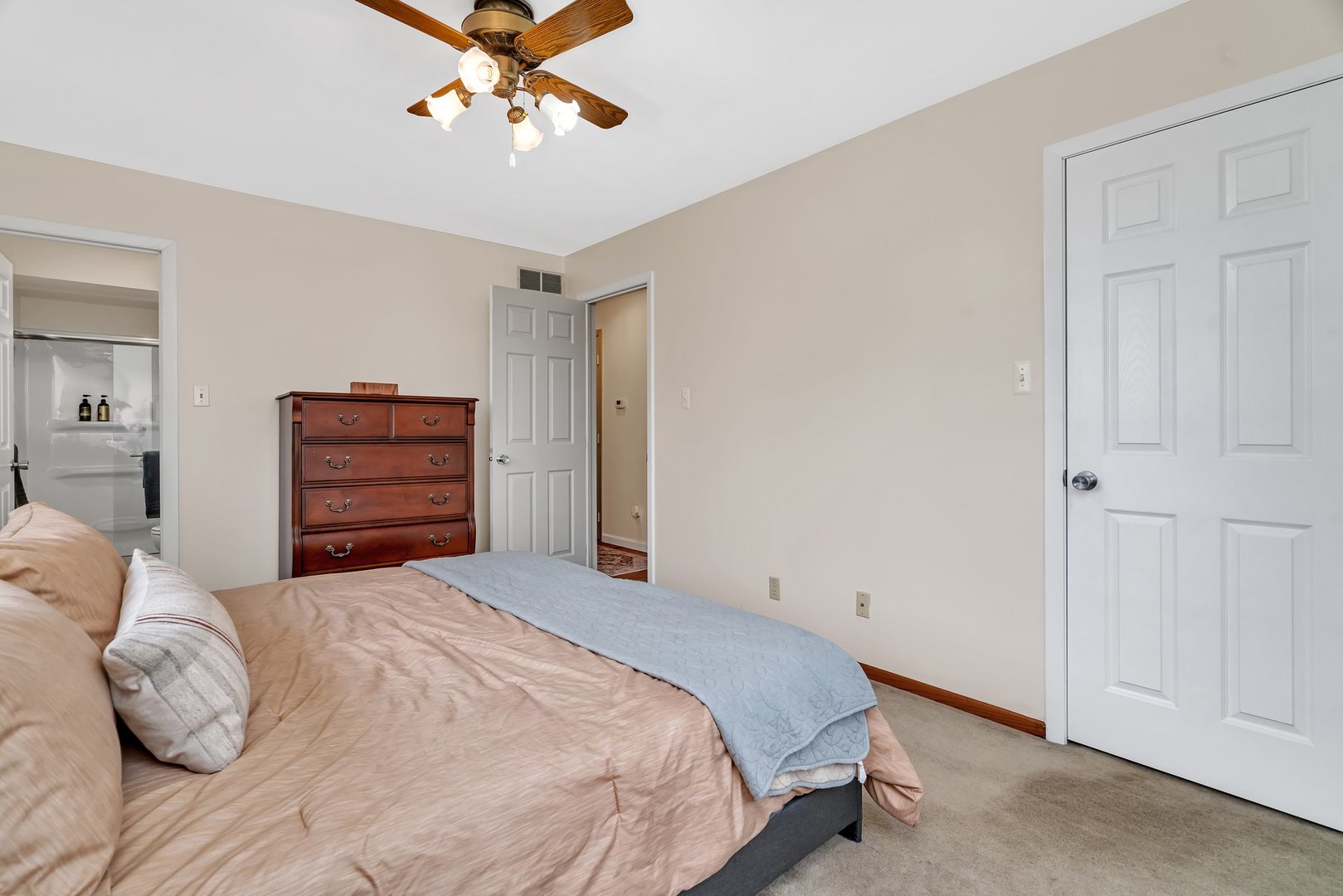 218 San Carlos Road Minooka, IL 60447 - Photo 25 of 40 a bedroom with a bed and a chandelier