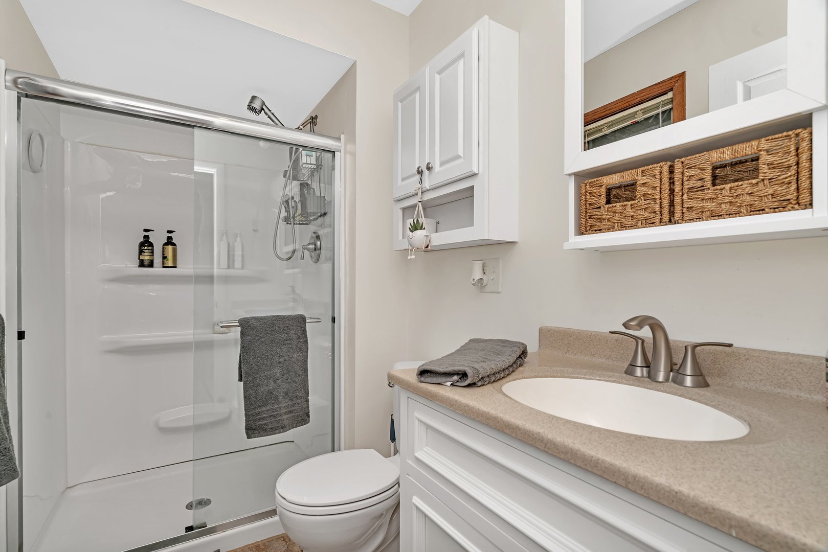 218 San Carlos Road Minooka, IL 60447 - Photo 26 of 40 a bathroom with a sink a toilet and shower