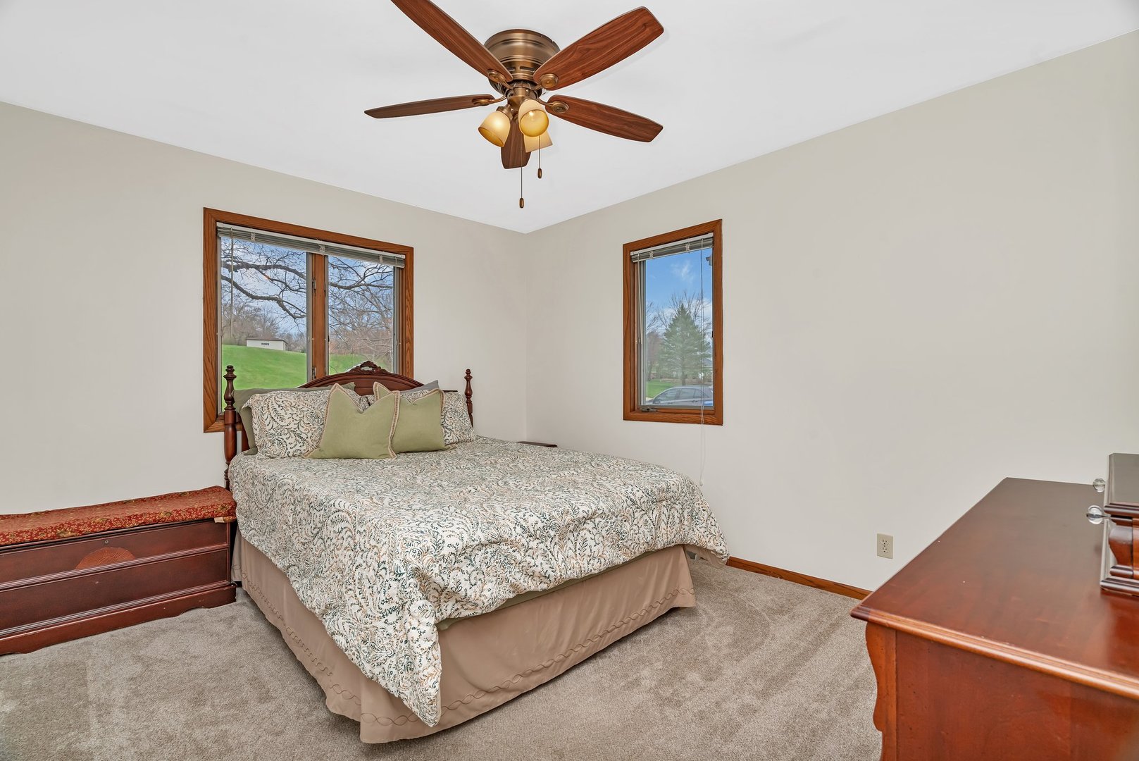 218 San Carlos Road Minooka, IL 60447 - Photo 28 of 40 a bedroom with a bed and a chandelier