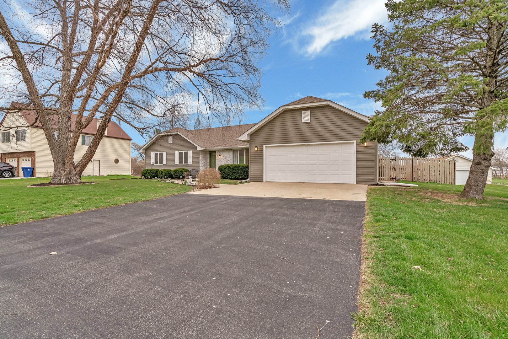 218 San Carlos Road Minooka, IL 60447 - Photo 3 of 40 a front view of a house with a yard and garage