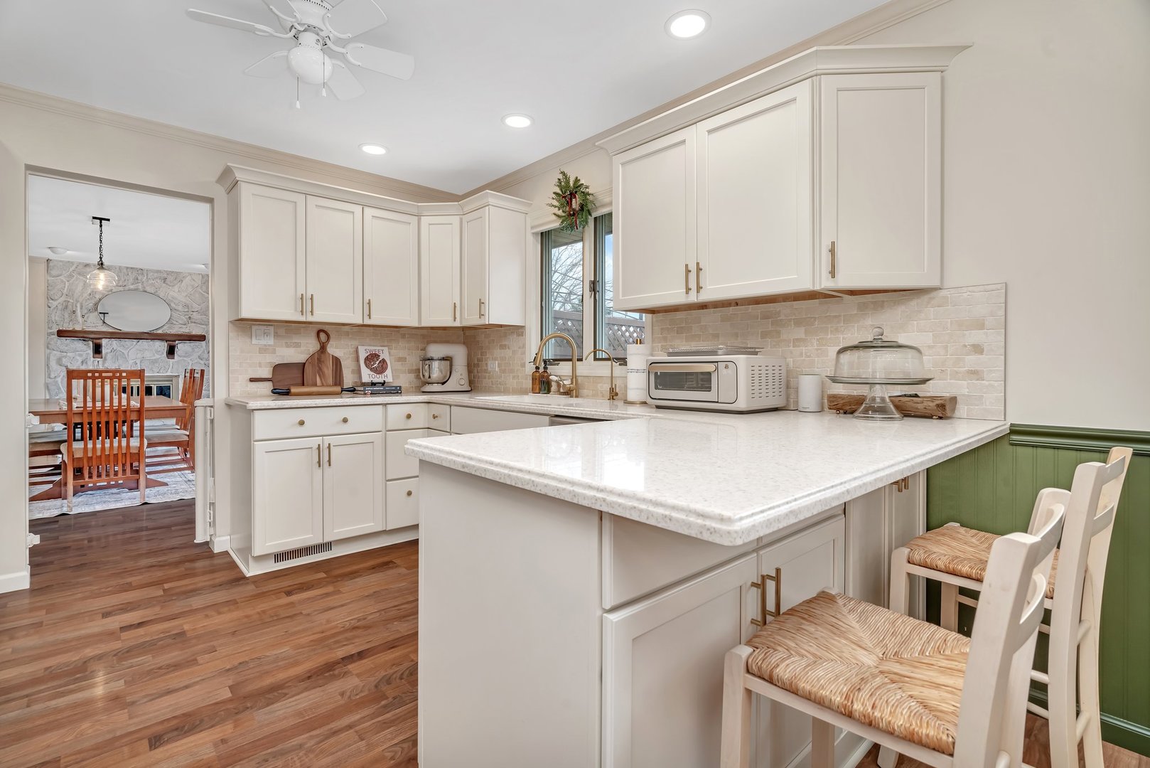 218 San Carlos Road Minooka, IL 60447 - Photo 10 of 40 a kitchen with a sink cabinets and wooden floor
