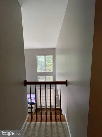a living room with fireplace furniture and a wooden floor