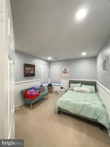 a bedroom with bed and window