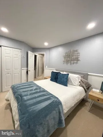 a large kitchen with a large window and stainless steel appliances