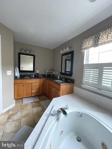 a living room with dining table and wooden floor