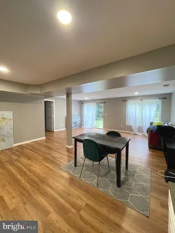 a living room with kitchen island furniture and a table