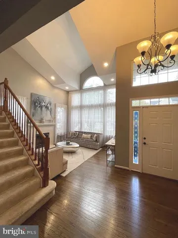 a view of an entryway with wooden floor