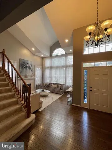 a view of a living room and entryway