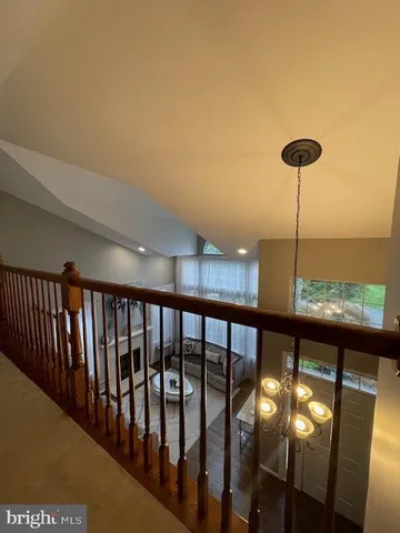 a living room with fireplace furniture and a wooden floor