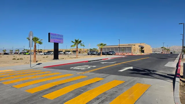 a view of a swimming pool with a outdoor seating and lake view