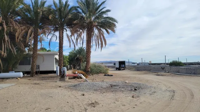 a view of a backyard with a sitting area