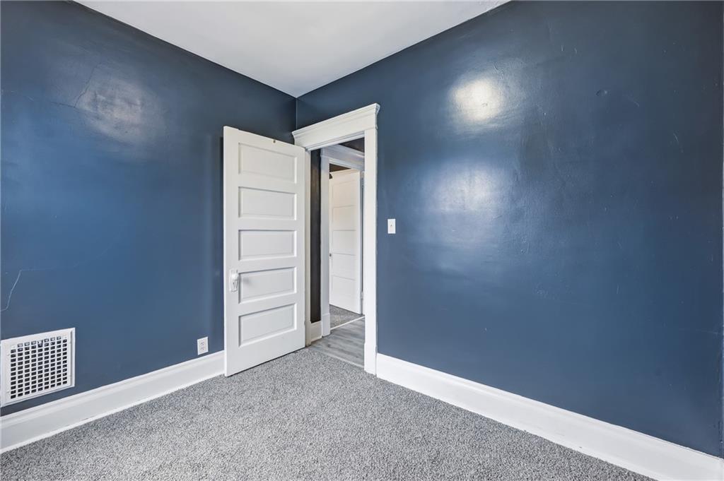 522 Wallis Avenue Farrell, PA 16121 - Photo 18 of 24 an empty room with closet and wooden floor