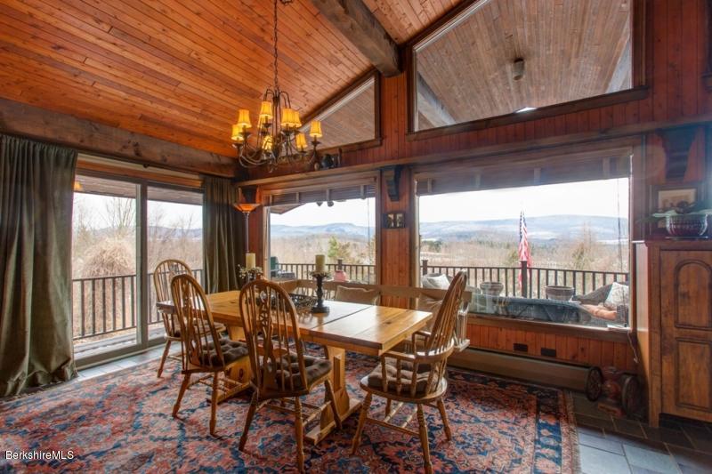 83 Sky Farm Road Copake, NY 12516 - Photo 14 of 38 a view of a dining room with furniture window and outside view