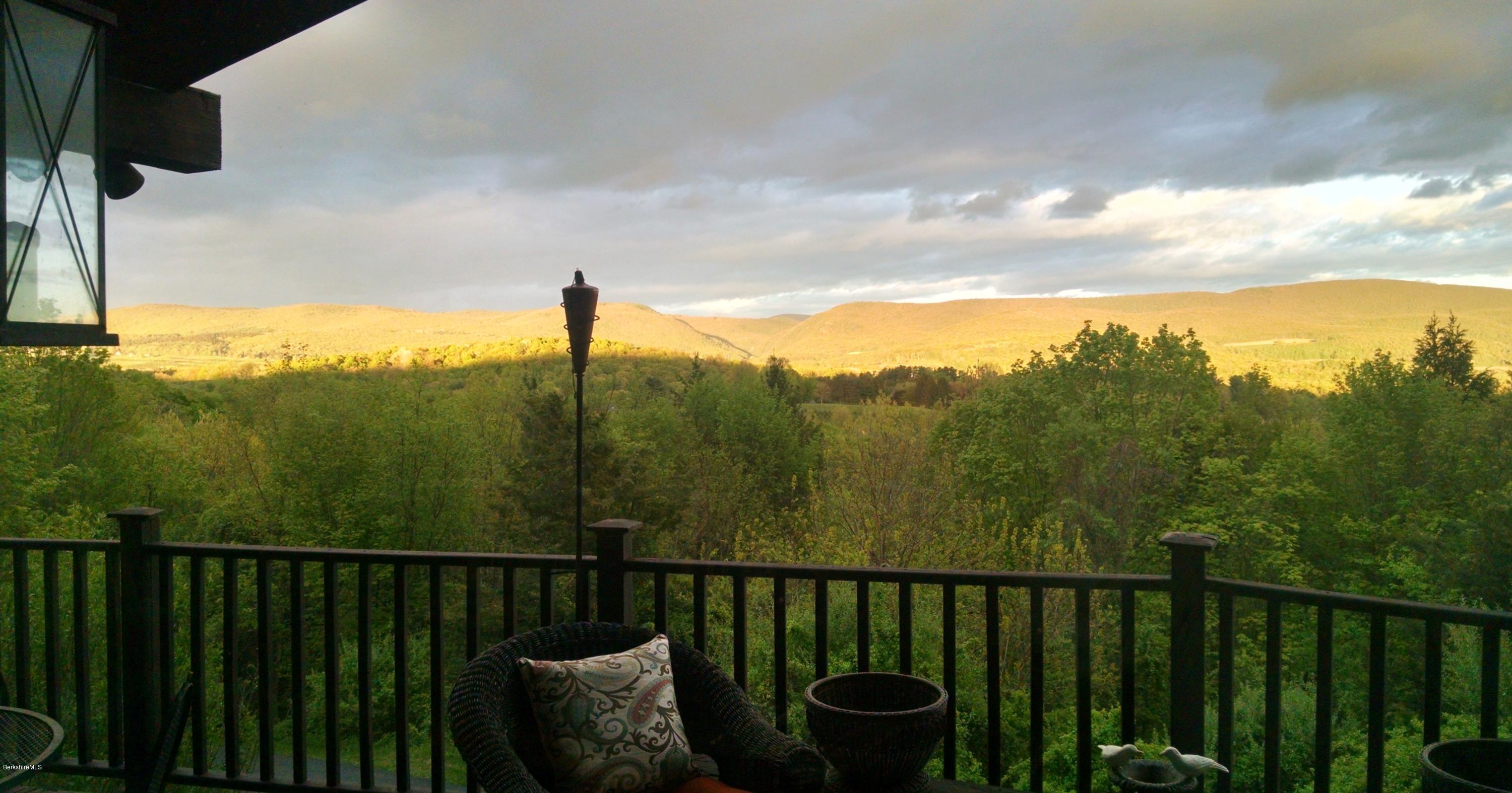 83 Sky Farm Road Copake, NY 12516 - Photo 17 of 38 a view of a balcony with an outdoor seating