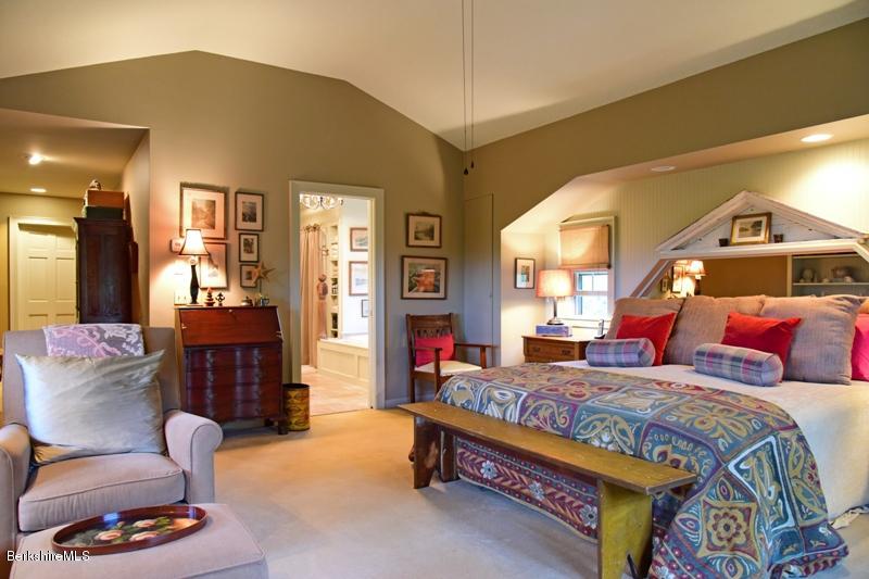83 Sky Farm Road Copake, NY 12516 - Photo 20 of 38 a bedroom with a bed a dresser and chair