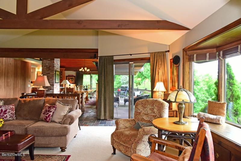 83 Sky Farm Road Copake, NY 12516 - Photo 3 of 38 a dining room with furniture and a large window
