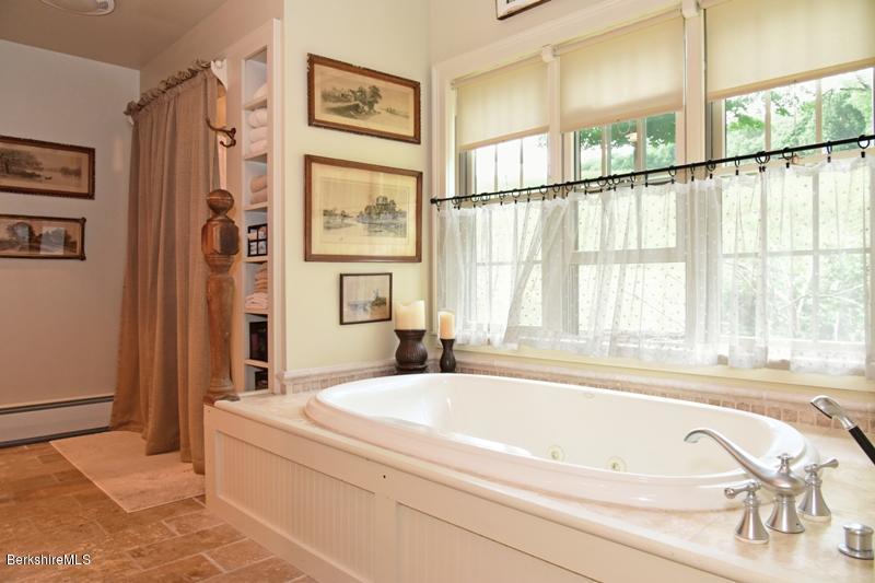 83 Sky Farm Road Copake, NY 12516 - Photo 23 of 38 a bath tub sitting next to a window