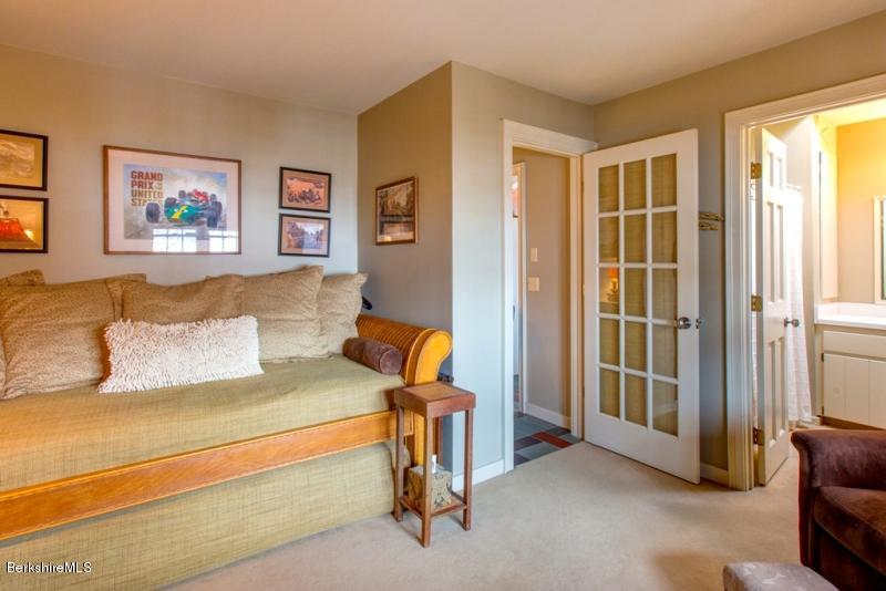 83 Sky Farm Road Copake, NY 12516 - Photo 30 of 38 a bedroom with a bed and a window