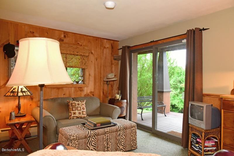83 Sky Farm Road Copake, NY 12516 - Photo 35 of 38 a living room with furniture and a window